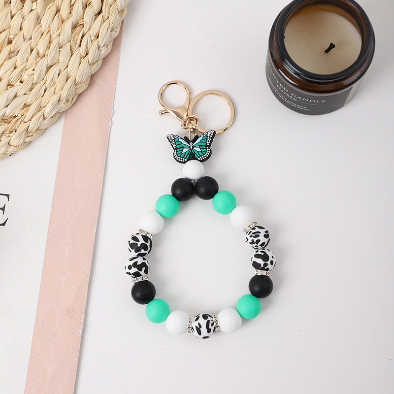Wholesale Rubber Tassel Silicone Wood Water Keychain